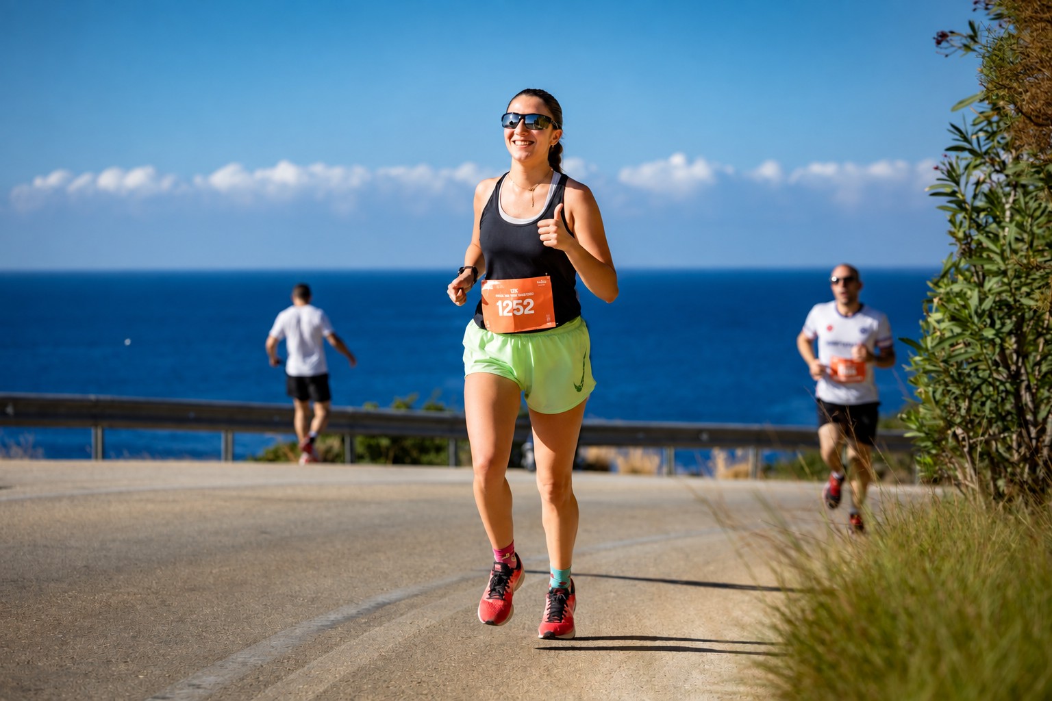 Runner on a coastal road beside the Mediterranean Sea