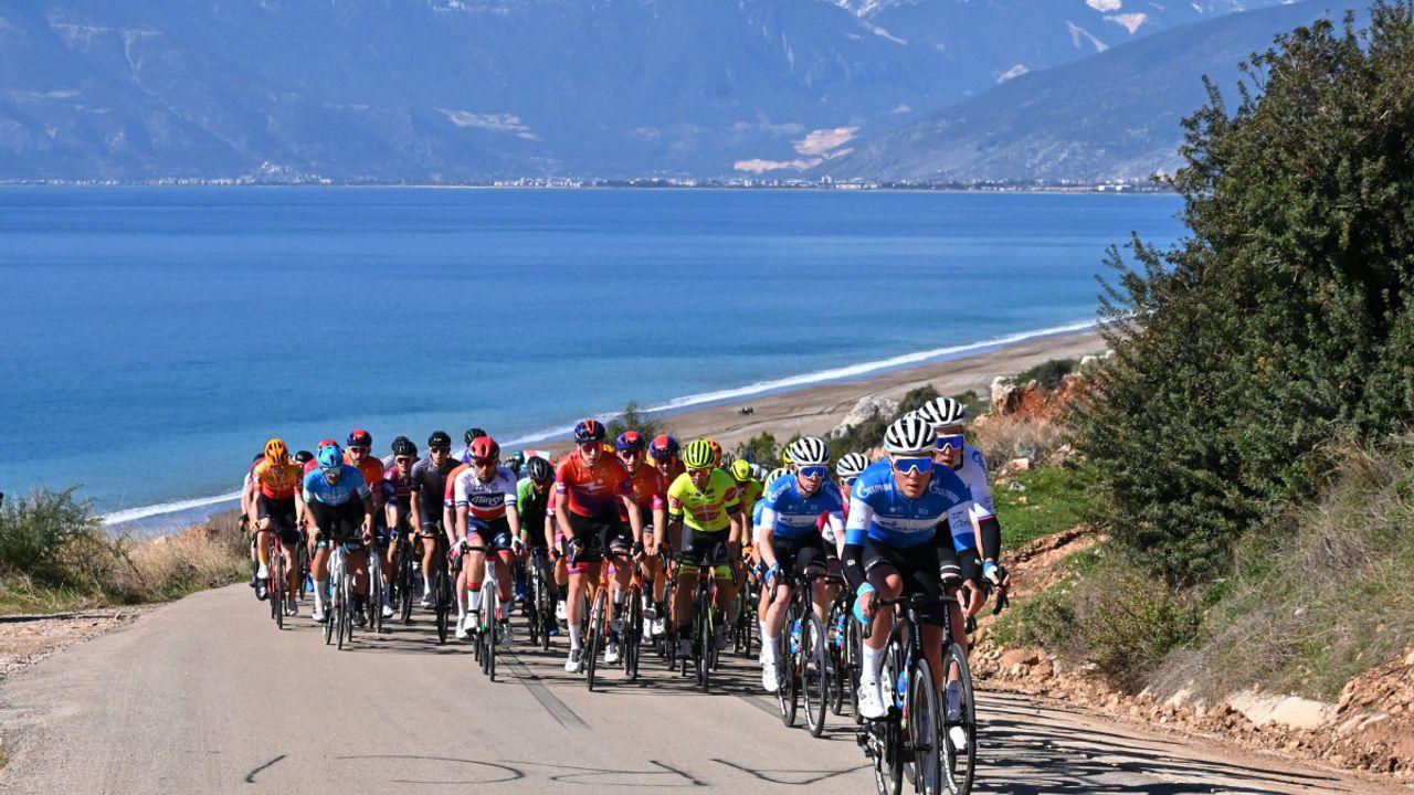 A group of cyclists training on a coastal road near Antalya